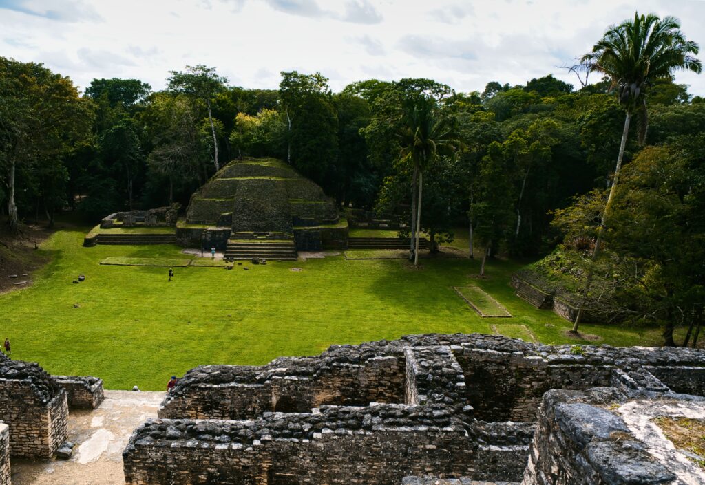 Explore the ancient Mayan ruins at Xunantunich surrounded by lush Belizean jungle.